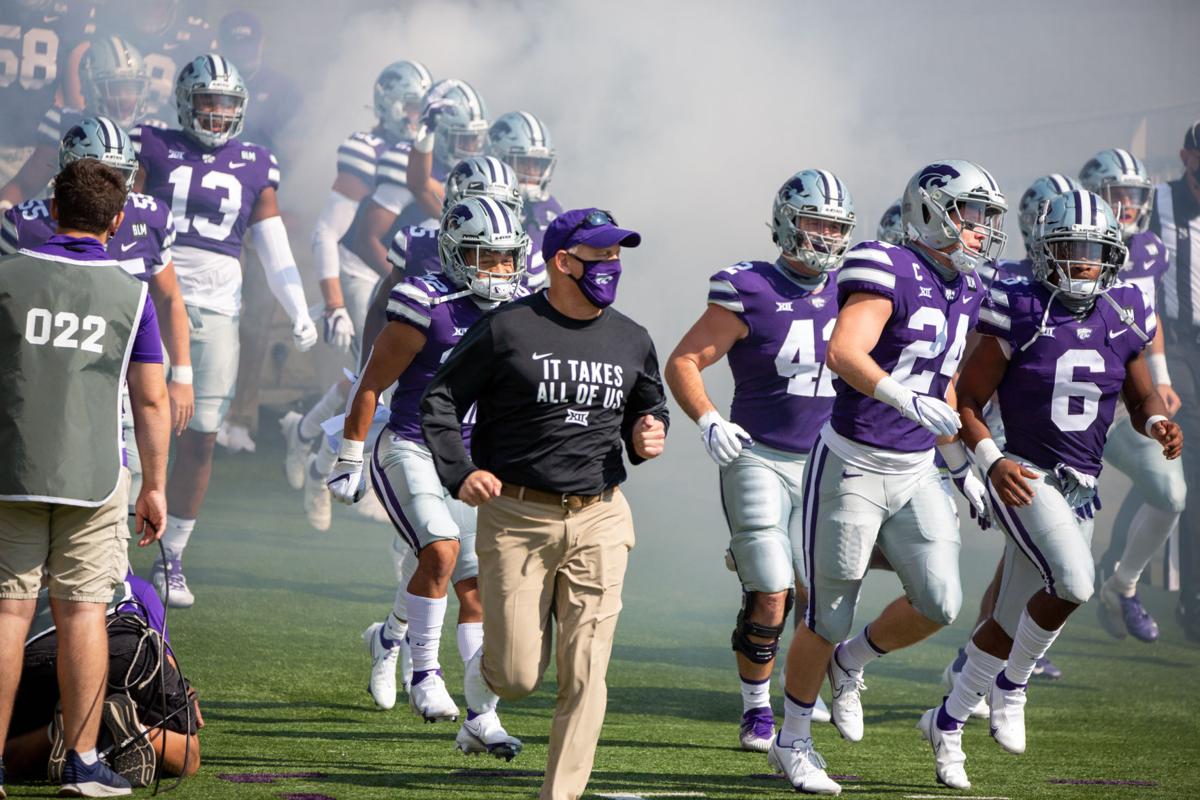 Chris Klieman leads his players onto the field at the beginning of the game. The Kansas State Wildcats faced off against Arkansas State wolves on Saturday at Bill Snyder Family Stadium, Arkansas State beat Kansas State 35 to 31.