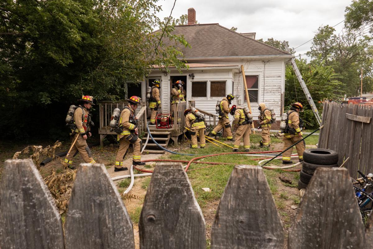 Firefighters from the Manhattan Fire Department respond to a call at 930 Thurston Street on Friday. The caller said smoke was exiting the back of the building and upon arrival the fire department found that the fire was mostly out and no one was injured or in the building.
