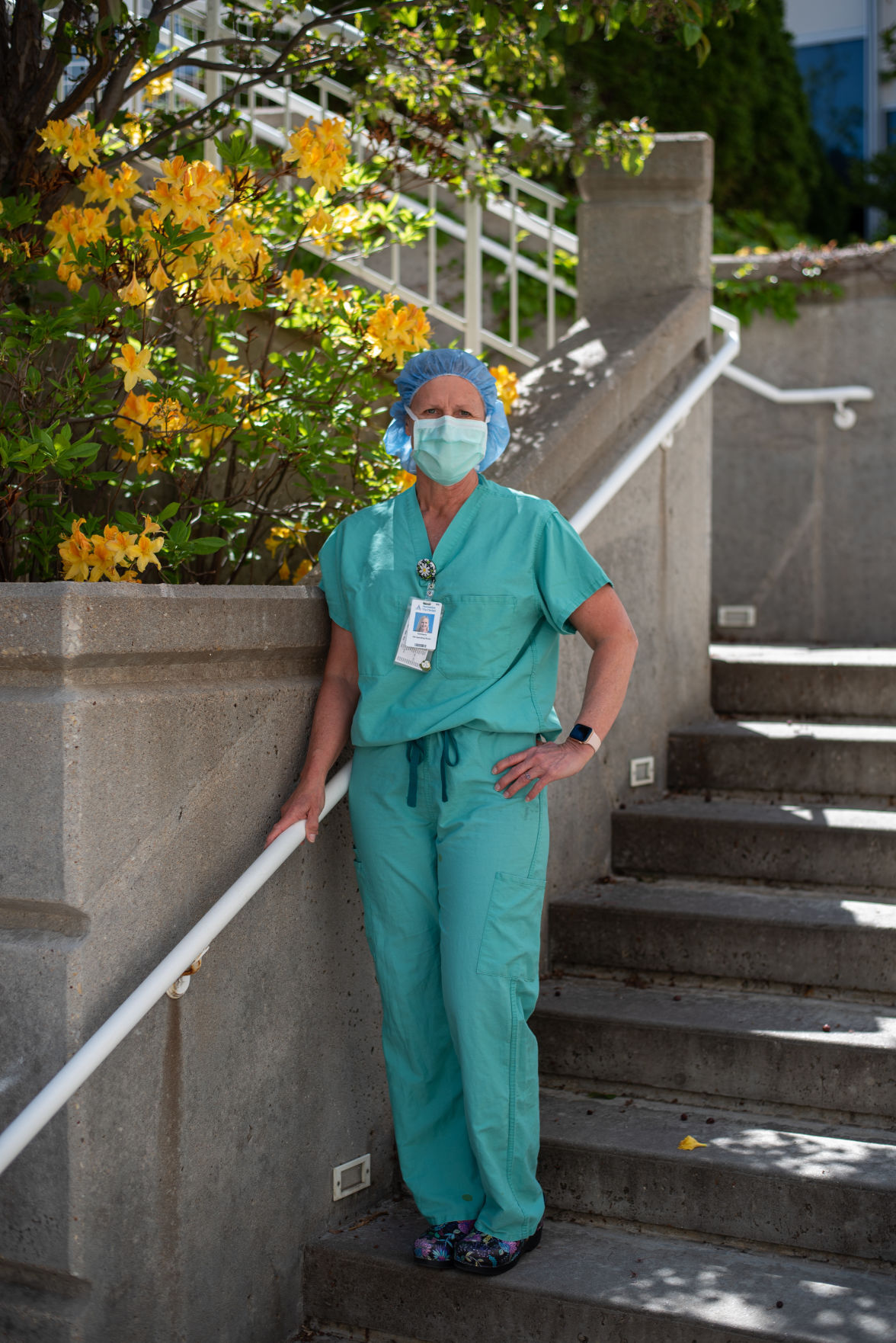 Kimberly Young, a peri-operative nurse at Ascension Via Christi Hospital, stands outside in the hospitals courtyard. Young has been working as a nurse for 32 years. “So, I try and make it feel like they’re here even though they’re not,” she added.