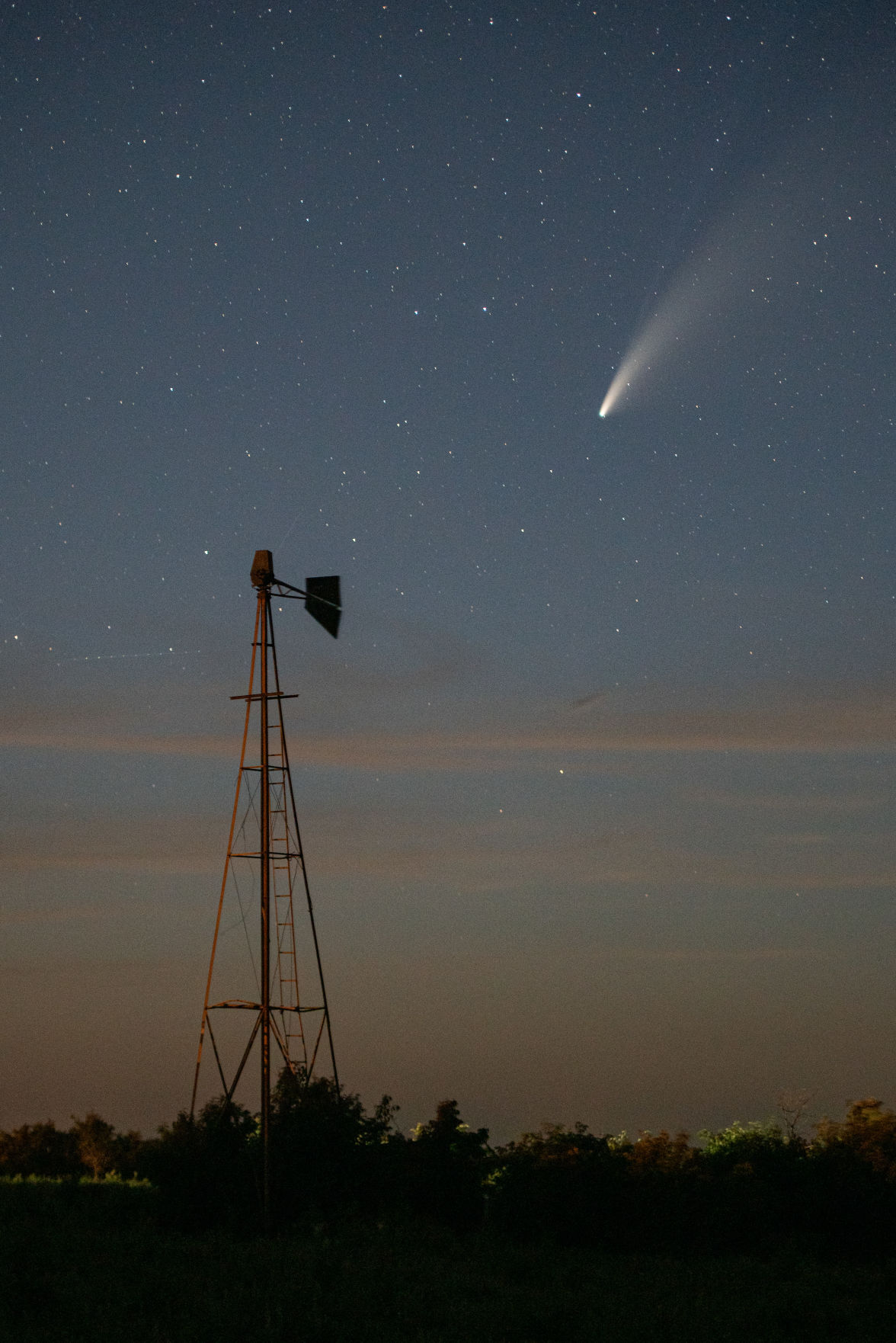Comet NEOWISE or C/2020 F3 flies above a windmill just north of Highway 16 on Shannon Creek Road at 10:26 p.m. The comet was first identified by the infrared-optimized NEOWISE spacecraft (short for Near-Earth Object Wide-field Infrared Space Explorer) on March 27, 2020 and will be visible to the naked eye until the end of July 2020. Comet NEOWISE can be found under the Big Dipper when looking in the Northwest direction. Comet NEOWISE is traveling at a speed of 17,500 miles per hour and wonÕt be visible for another 6,800 years.