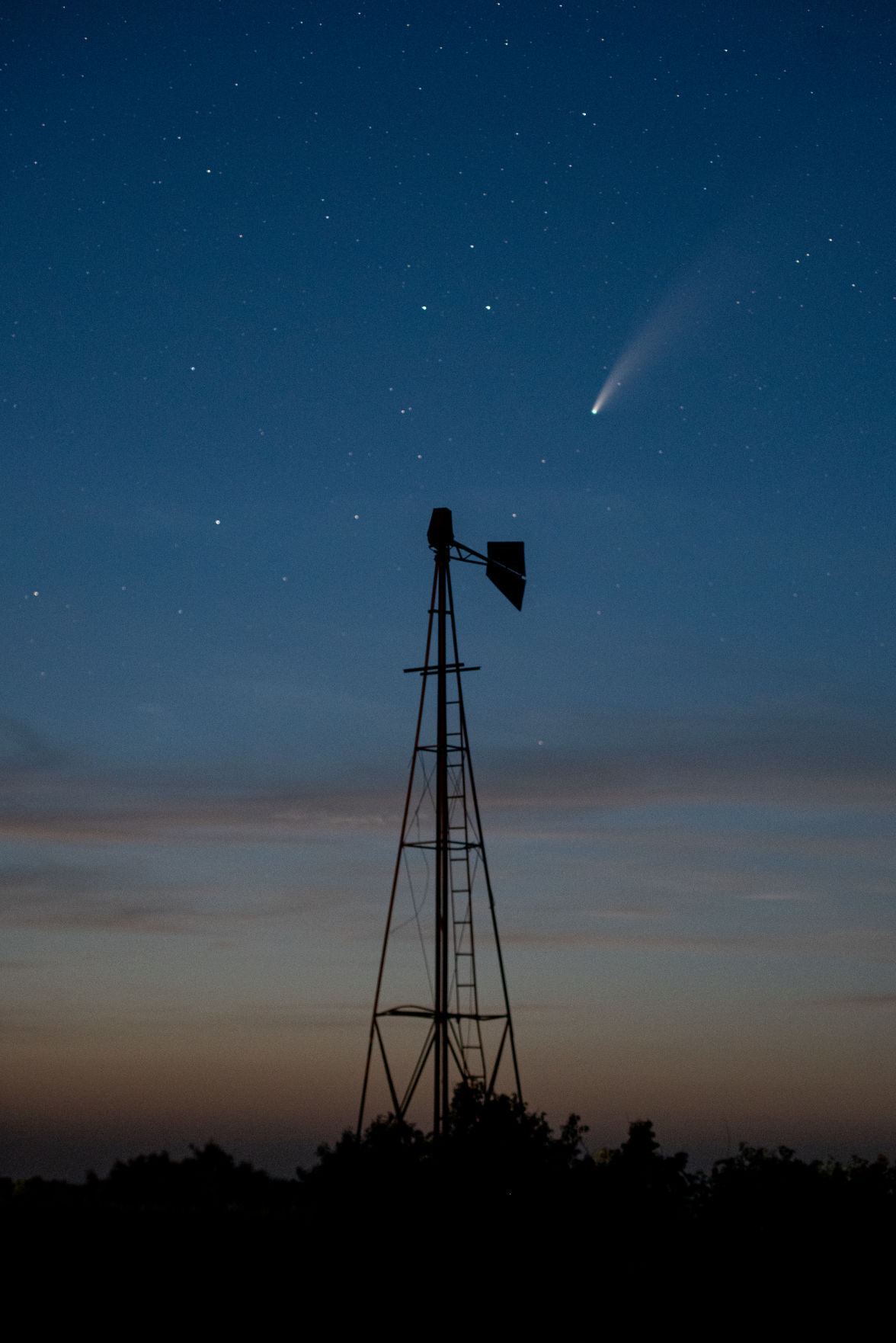 Comet NEOWISE or C/2020 F3 flies above a windmill just north of Highway 16 on Shannon Creek Road at 10:13 p.m on Friday. The comet was first identified by the infrared-optimized NEOWISE spacecraft (short for Near-Earth Object Wide-field Infrared Space Explorer) on March 27, 2020 and will be visible to the naked eye until the end of July 2020. Comet NEOWISE can be found under the Big Dipper when looking in the Northwest direction. Comet NEOWISE is traveling at a speed of 17,500 miles per hour and won’t be visible for another 6,800 years.