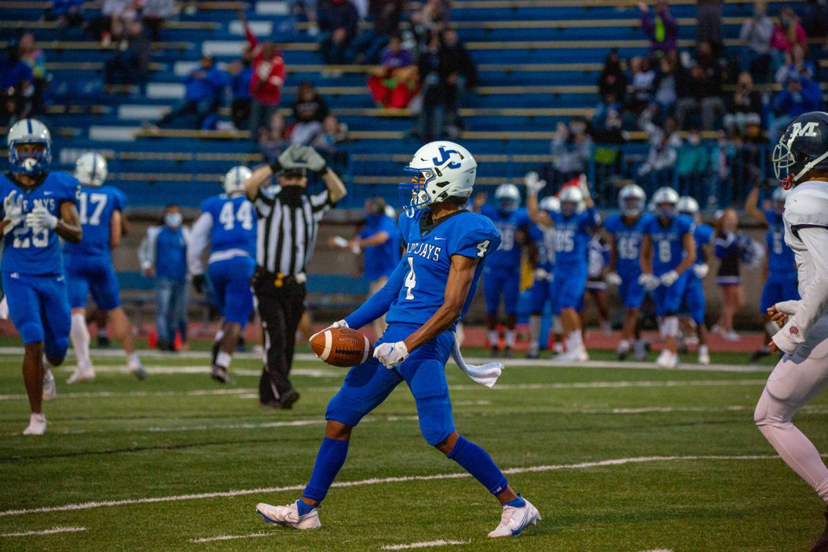Junction City’s (number 4) celebrates after intercepting the ball. Manhattan High Indians went head to head against the Junction City Bluejays on Friday night at Al Simpler Stadium with a final score of Junction City 36, Manhattan 29.