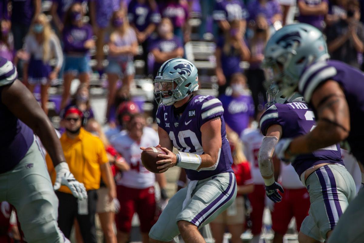 Skylar Thompson, senior quarterback, fakes a pass off to teammate and searches for someone to throw to. The Kansas State Wildcats faced off against Arkansas State wolves on Saturday at Bill Snyder Family Stadium, Arkansas State beat Kansas State 35 to 31.