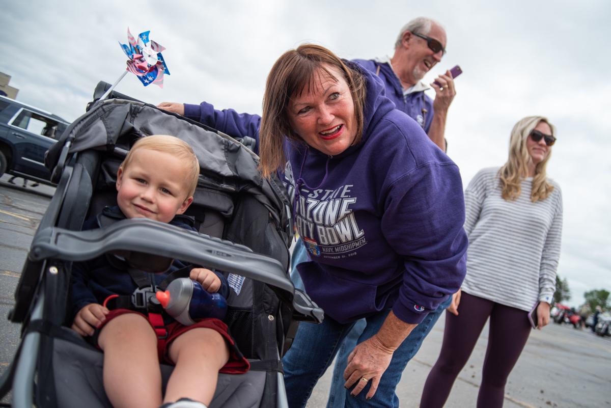 From left, Hudson Cassel, Katy Ames, Alan Ames and Kim Cassel talk to Shane Kiersey on the phone while standing outside of Ascension Via Christi Hospital while waiting for the National GuardÕs 190th Air Refueling Wing flies over on Tuesday.