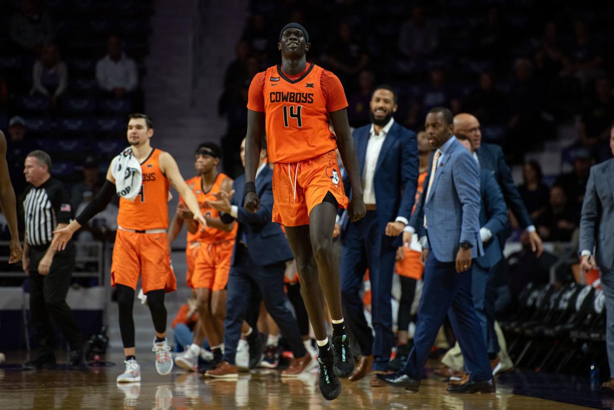 Yor Anei (14) jumps in the air during a timeout after making a shot on the prior play.