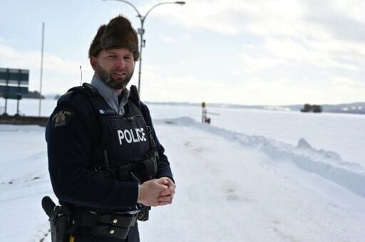 Royal Canadian Mounted Police Corporal Keven Rouleau stands near the Canada-US border, where he says illegal crossings take place in the winter months