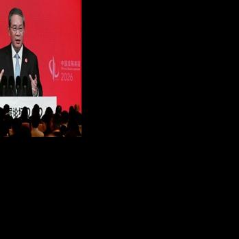 Chinese Premier Li Qiang seen on a big screen live broadcasting his speech at the opening of the China Development Forum
