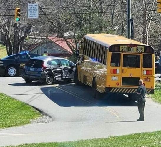 Stopped school bus hit in accident, car lands in ditch News