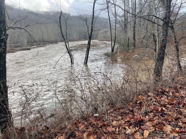 Pigeon River flooding in Pigeon Forge behind Christmas Place