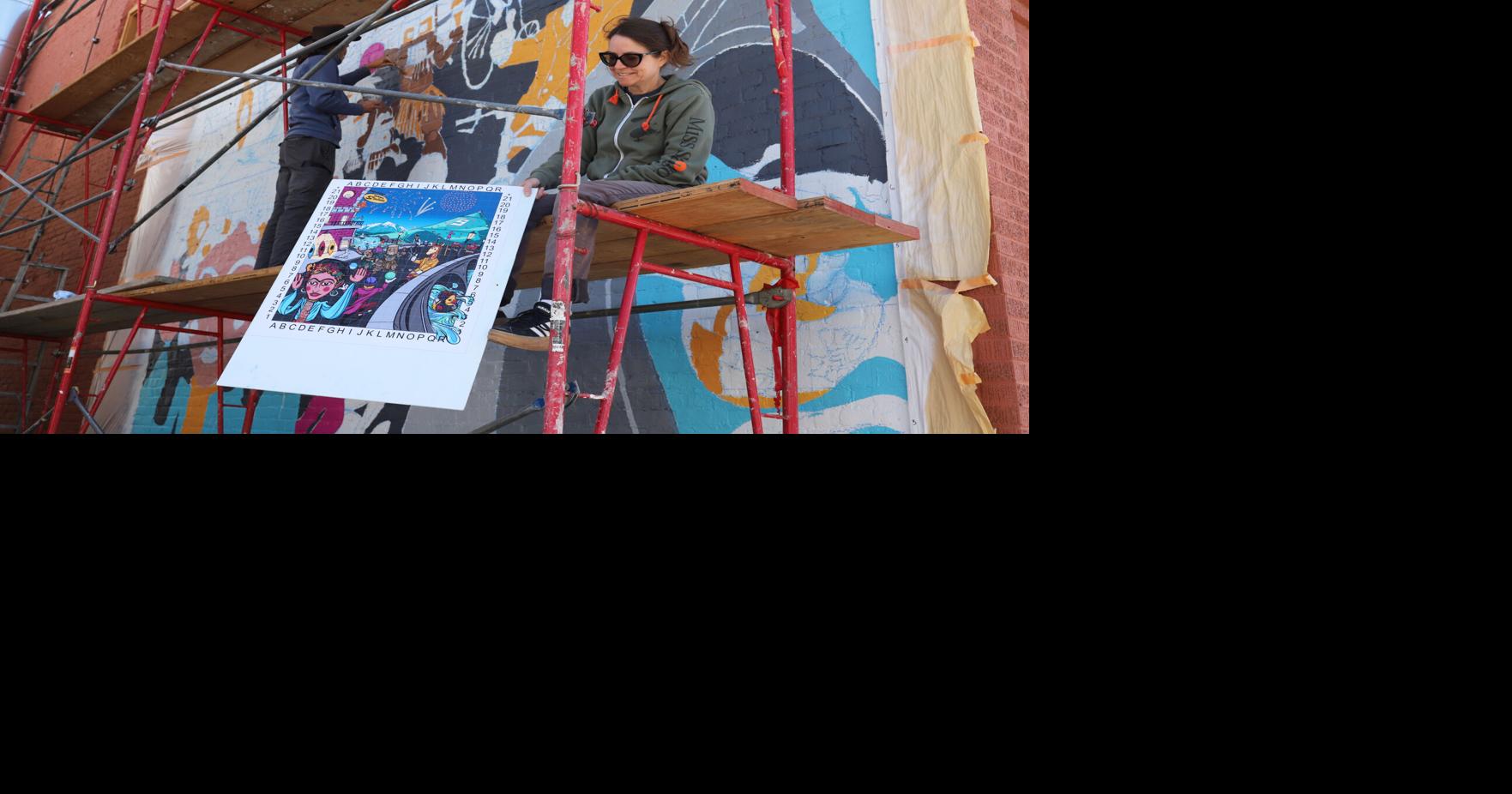 Brandon and Mishawn work on Salida-themed mural on Second St.