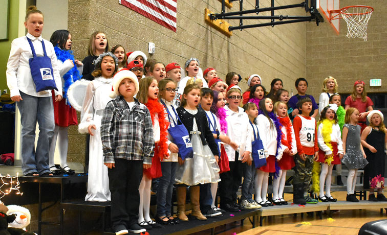 Third- and fourth-graders sing at the Longfellow Elementary School choir’s Dec. 5 performance
