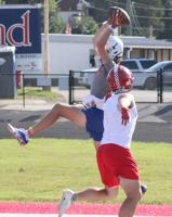 Ethan Miller makes a leaping grab.