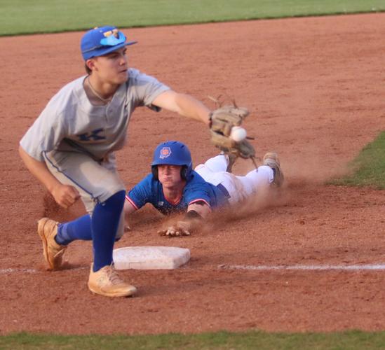 Zach Ross slides into third base during the game against Karns on Monday night.