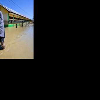 Indonesia flood survivors battle mud, trauma