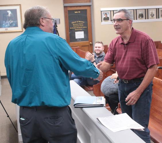 Bill Thompson, one of the Campbell County Volunteers of the Year, shakes the hand of Campbell County Mayor Jack Lynch at the county commission workshop on Nov. 14.