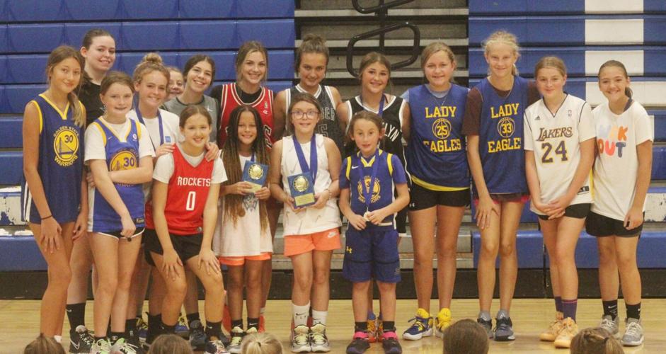 The Jacksboro Lady Eagles taking a picture with the third through fifth grade award winners.