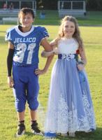 Allison Moses being escorted by Isaiah Adkins.