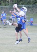 Carter Terry jumps over a defender.