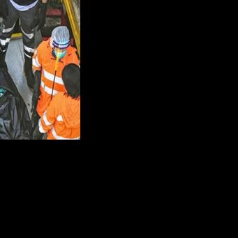 'Tormenting': Relatives search through images of the dead after Hong Kong blaze