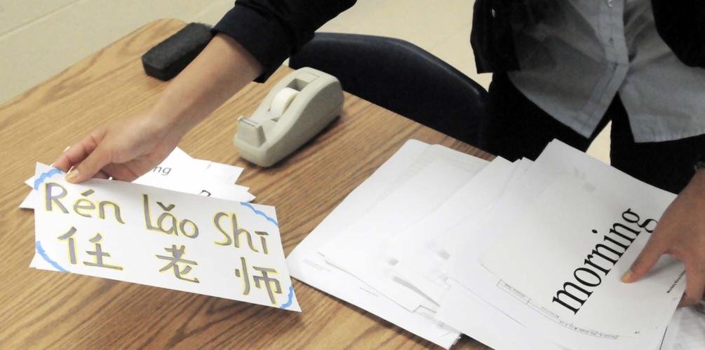 Traveling to teach Ren 'Lolly' Hui educating HCS students on Chinese