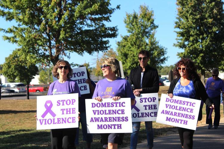 Dozens walk to support domestic violence victims | Local News ...