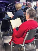 Community members brought together through hymns