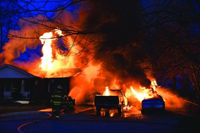 Vehicles lost, home damaged by fire