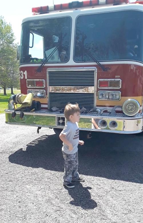 Firefighters bring joy to young fan