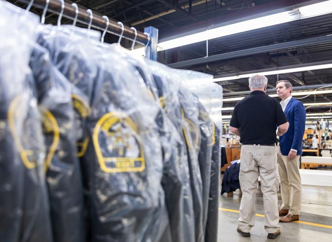 Beshear tours plant, expansion at Nationwide Uniform in Hodgenville