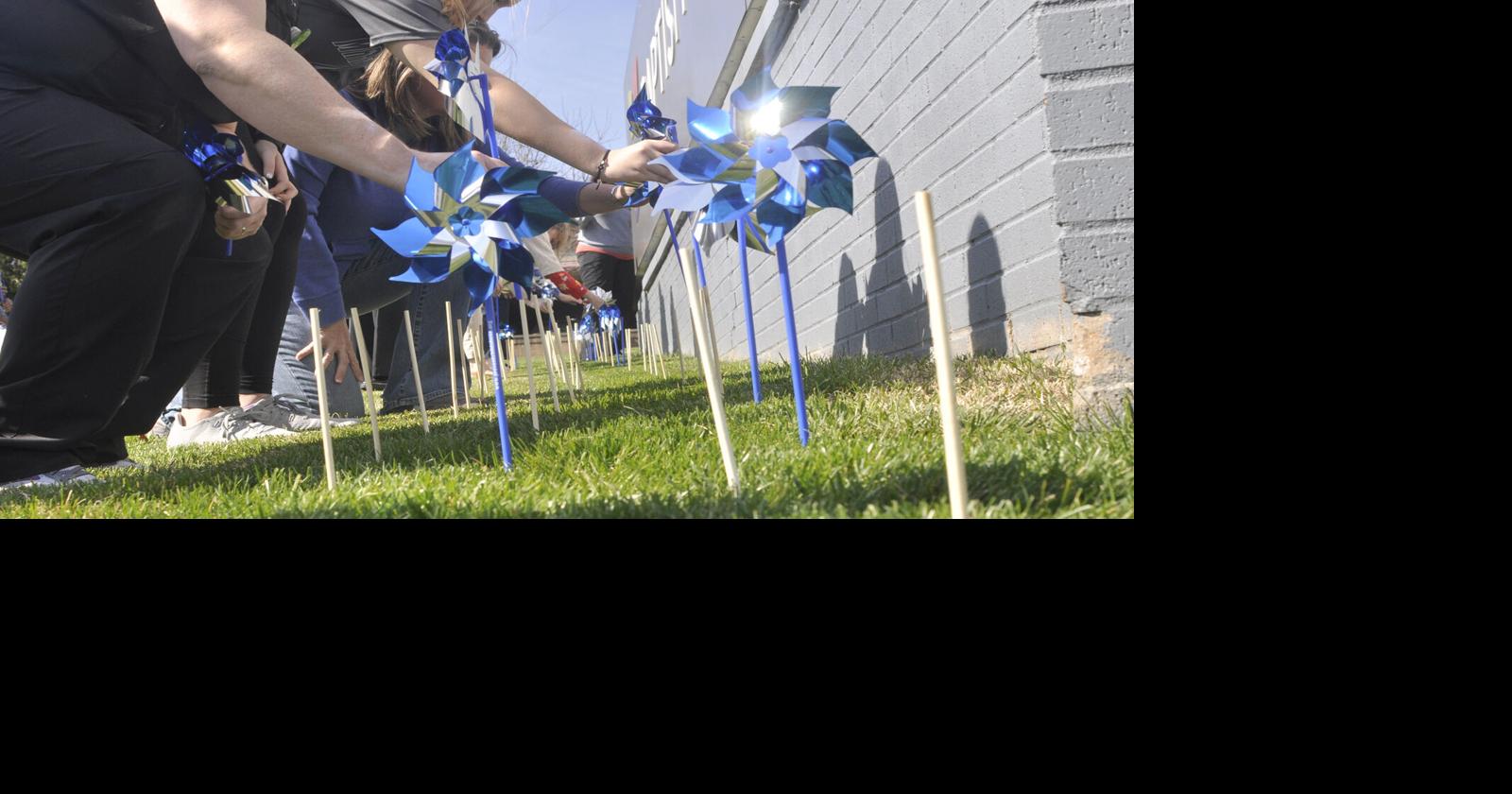 Hospital employees plants pinwheels in honor of abused children | Local ...