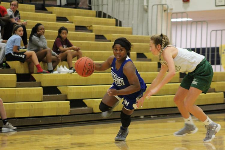 GIRLS’ BASKETBALL Lady Trojans adjusting to new roles Sports