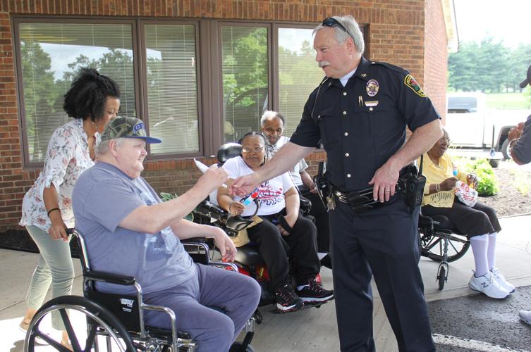Radcliff police help youngsters beat the heat with Popsicles Local