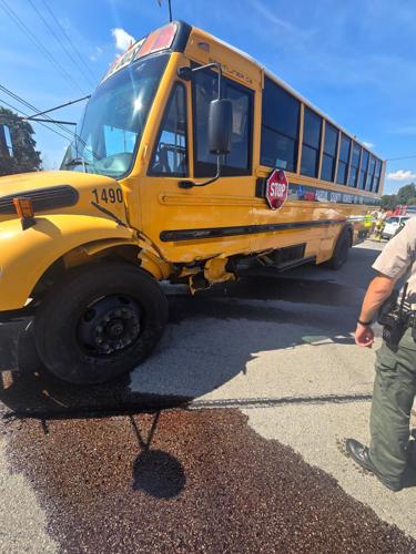 Driver of car seriously injured in crash involving empty school bus ...