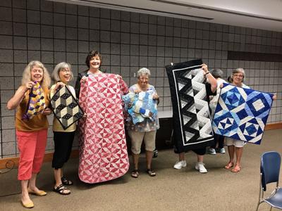 Nine Patchers Quilt Guild members accept the challenge