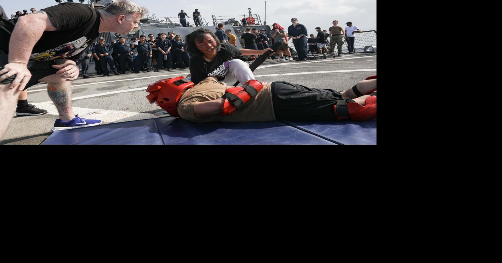 Hodgenville native instructs a sailor during security reaction force ...