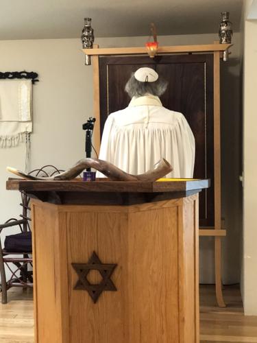 Rabbi Yossi leading services for High Holidays.JPG