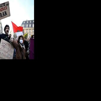 'Stop the massacres in Iran,' read one sign after activists said thousands had been killed in the Iran protest crackdown