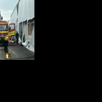 Firefighters battle a blaze in a pavilion of the COP30 UN Climate Change Conference in Belem