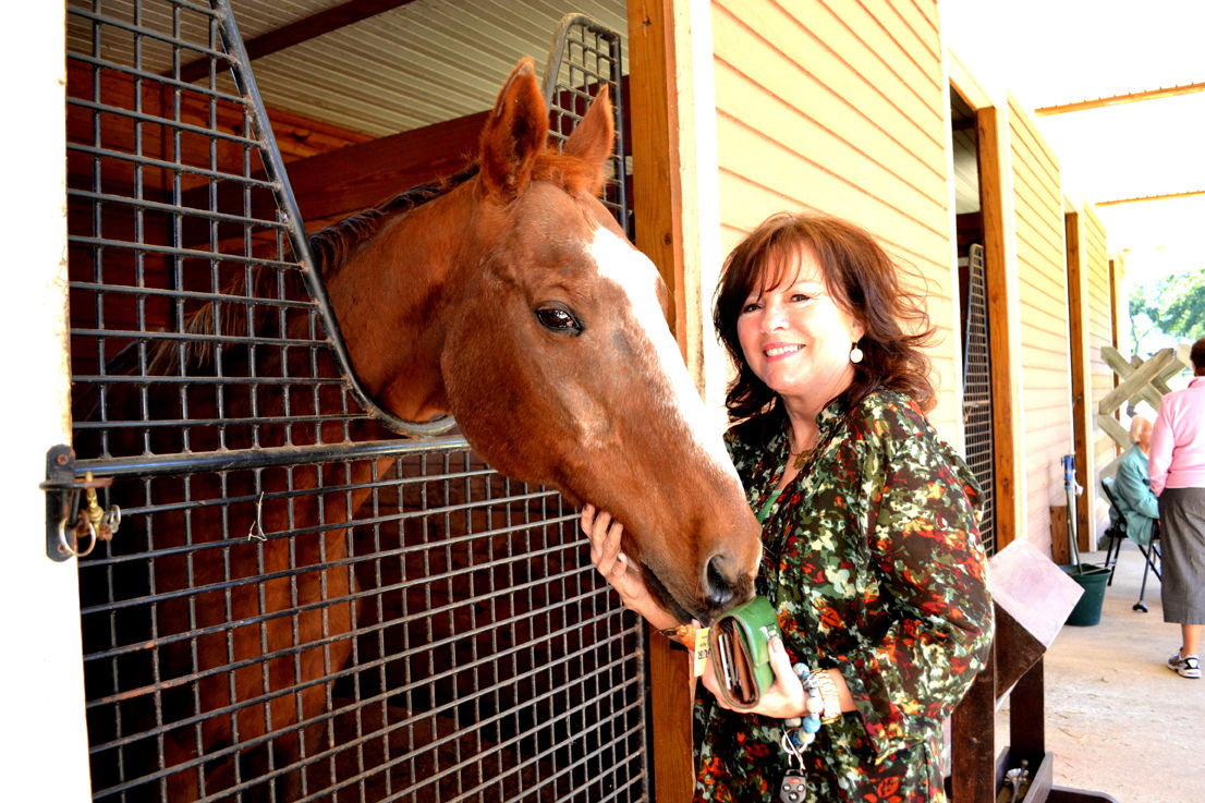 diane webber posing on horse