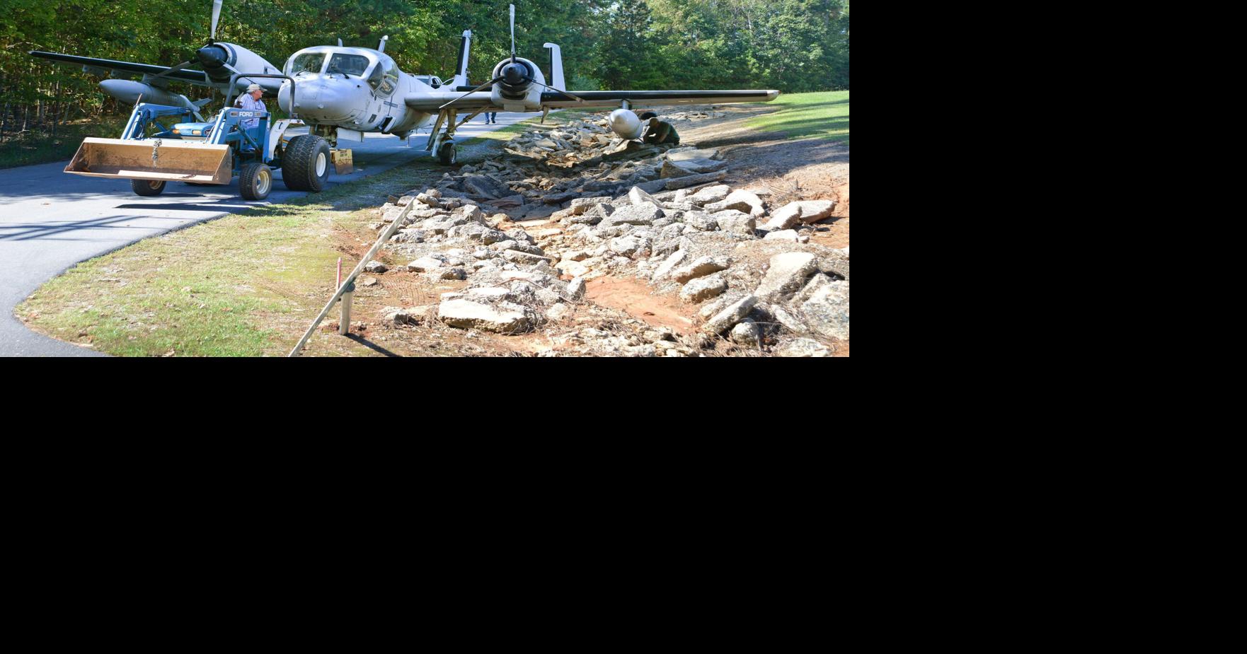 A Grumman OV-1 Mohawk is moved to the new James R. McConnell Air Museum ...