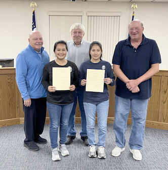 Commissioners congratulate Salazar and Morie on U.S. Citizenship
