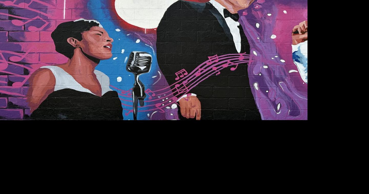 Heartland Artists paint mural at Kingpin Lanes