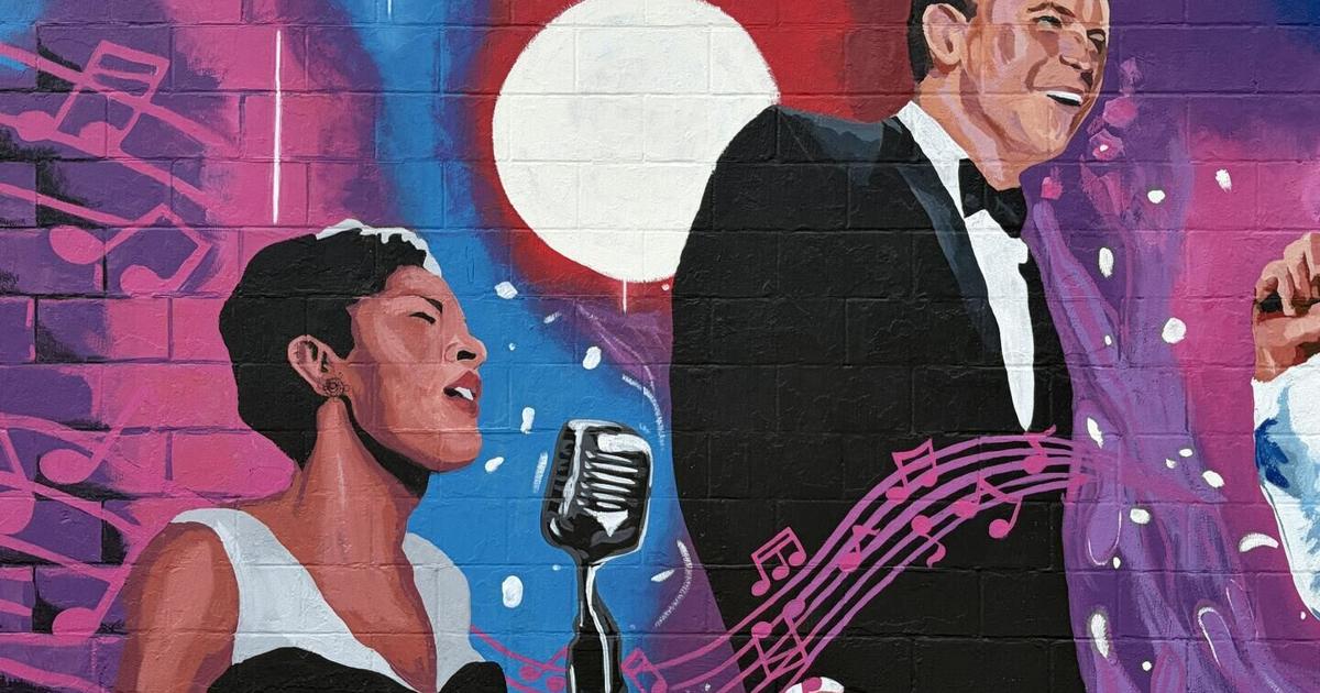 Heartland Artists paint mural at Kingpin Lanes