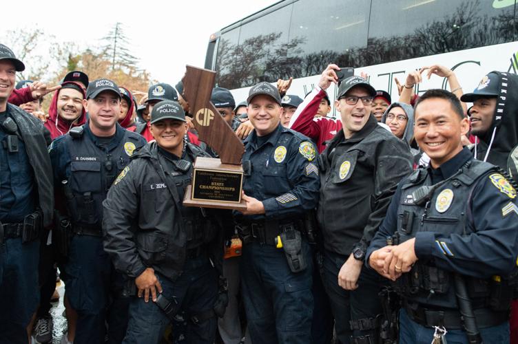 Liberty state champions arrive home
