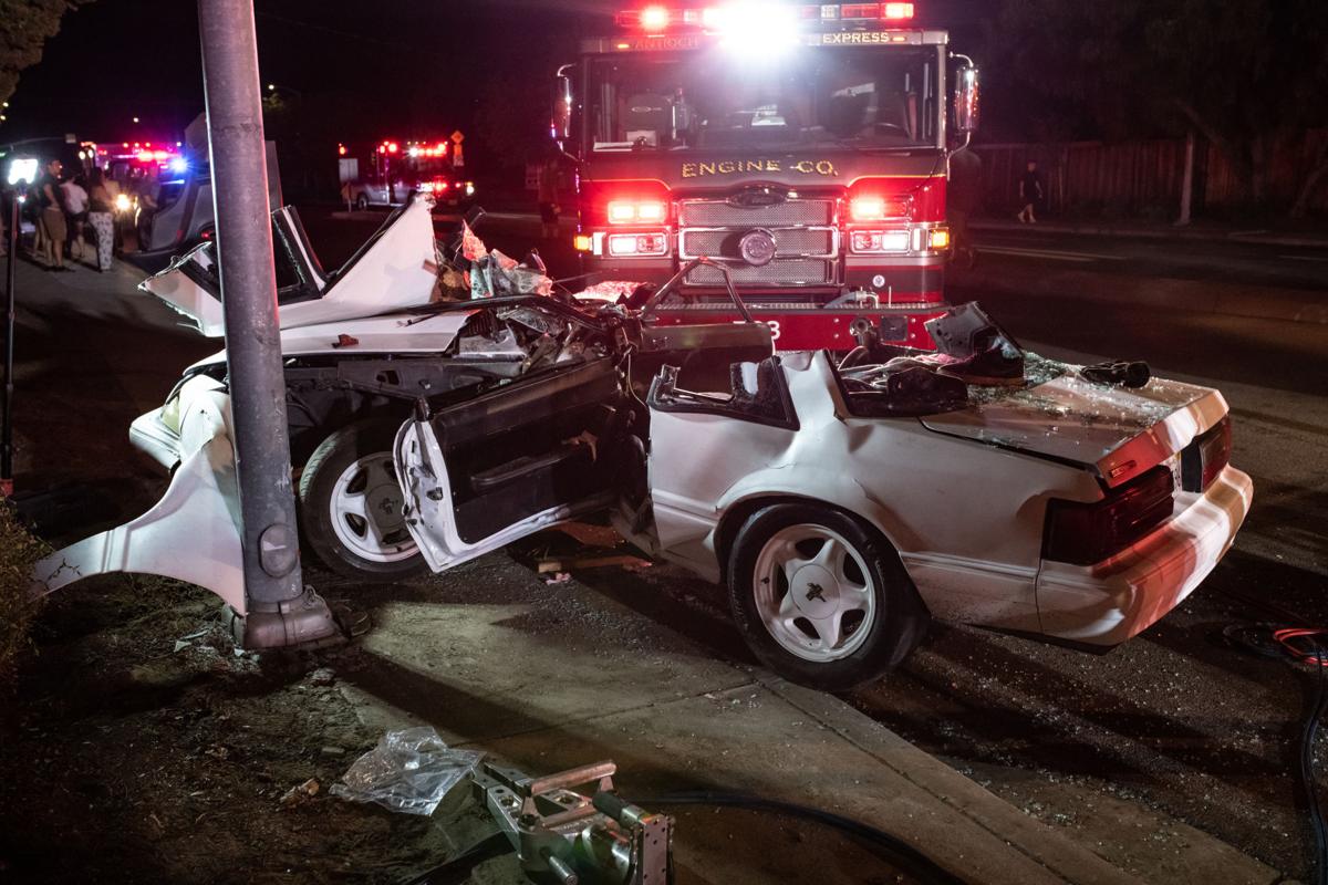 Car strikes light pole in Oakley