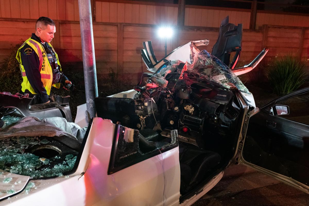 Car strikes light pole in Oakley