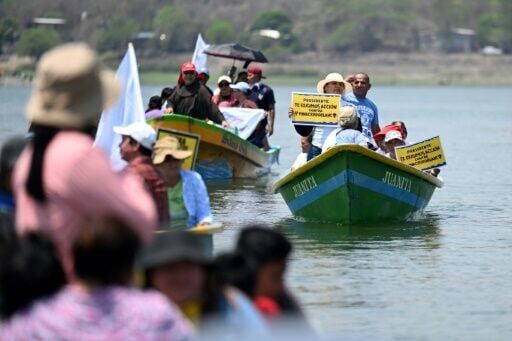 Activists from El Salvador, Guatemala and Honduras hold a protest on Lake Guija against a Canadian-owned gold mine