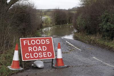 Flooding closing area roads; sandbags available