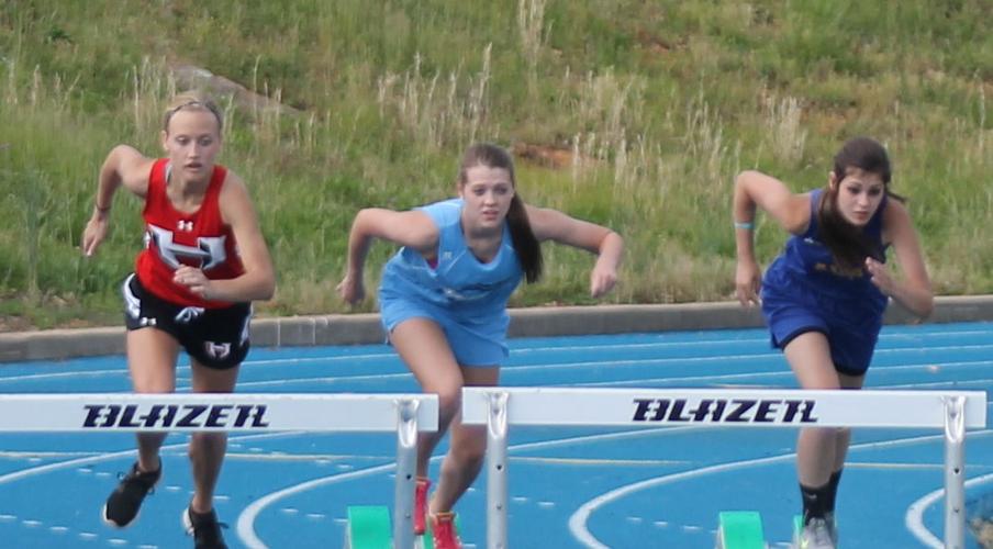 Alexis Crocker competing in the hurdles