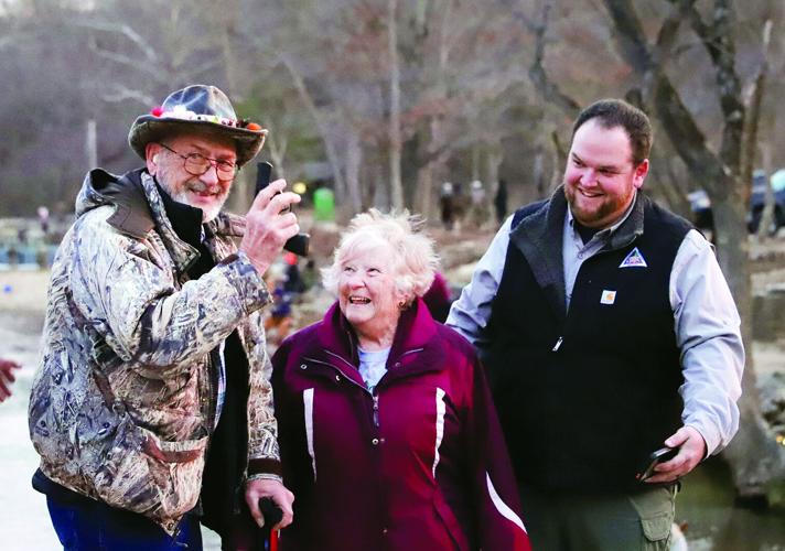 Robert Christensen (left) fired the pistol at 6:30 a.m. sharp